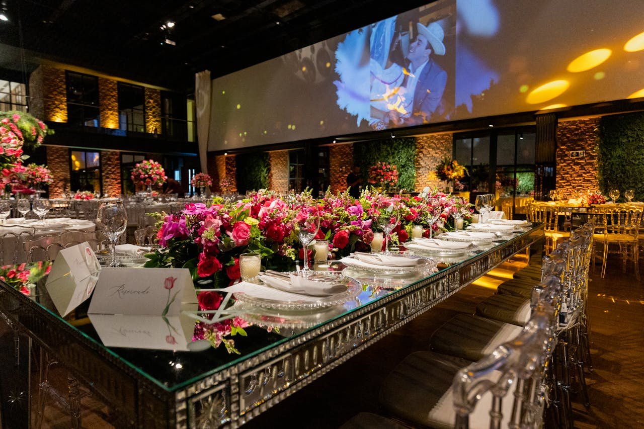 Luxurious wedding reception setting with vibrant floral arrangements and elegant decor.